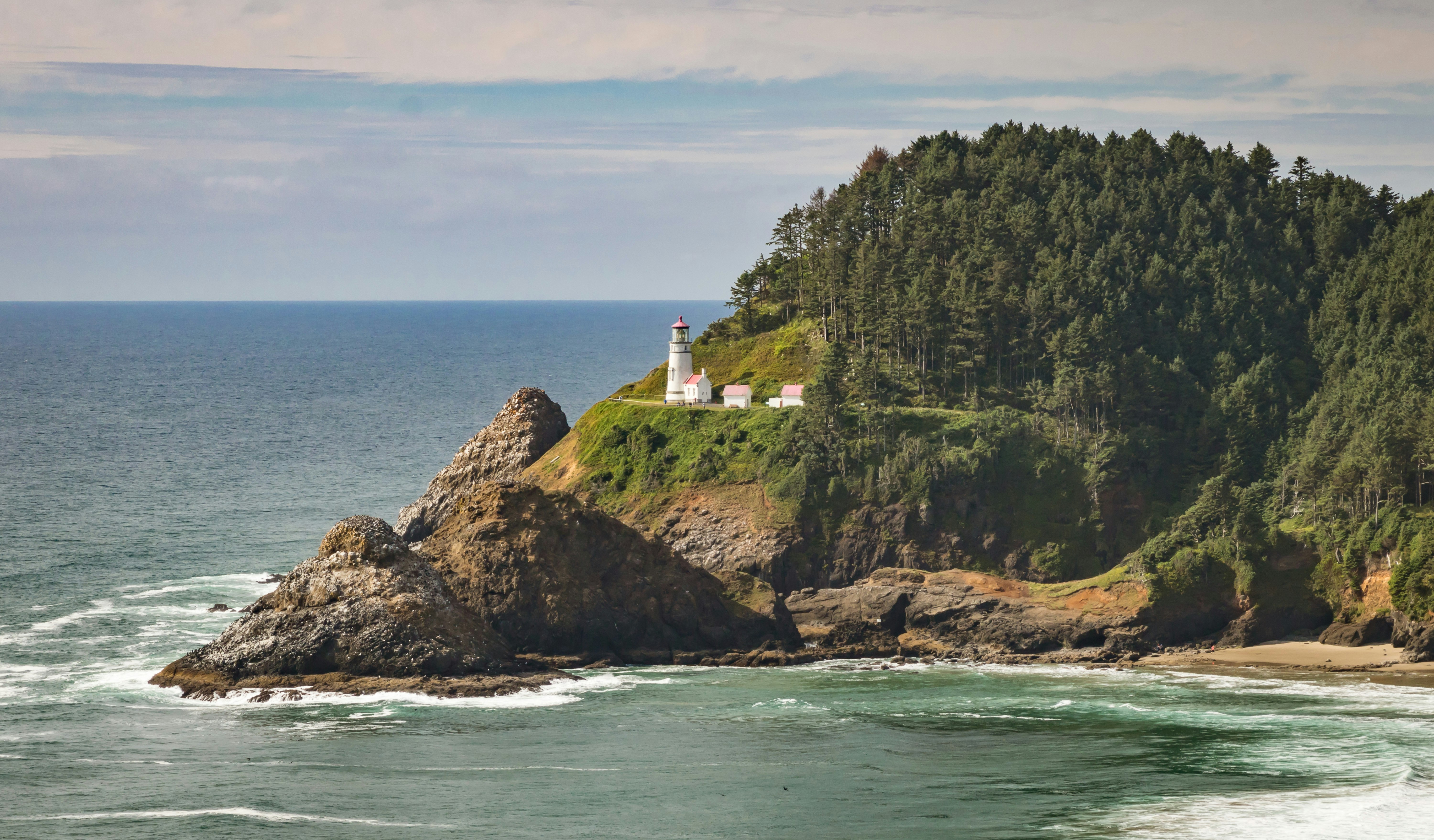 body of water and white lighthouse